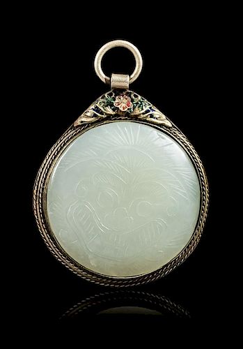 A White Jade Inset Silver Pendant Diameter of jade 1 3/4 inches.