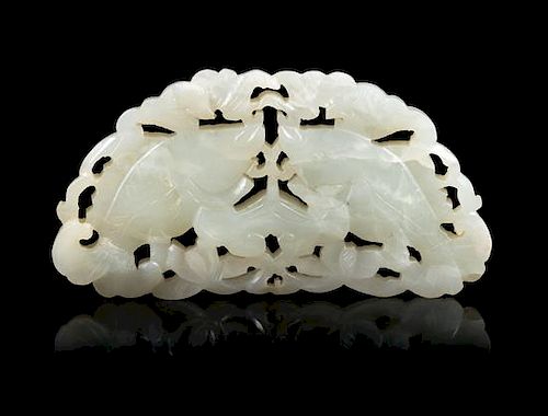 An Openwork Pale Celadon Jade 'Fish' Pendant Length 3 3/4 inches.