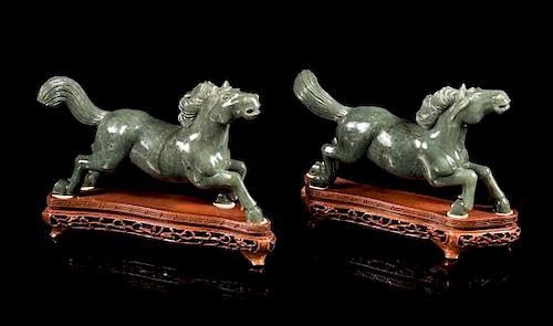 * A Pair of Spinach Jade Figures of Horses Length of each 8 1/4 inches.