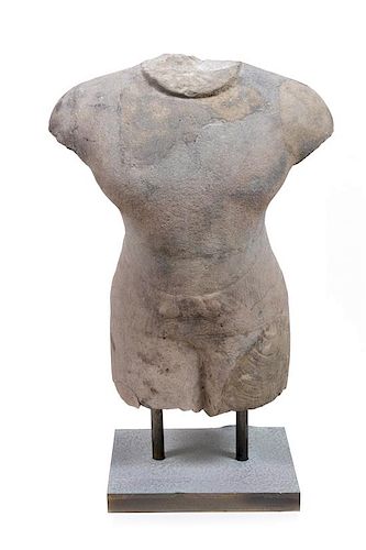 * A Khmer Stone Torso of a Temple Guard Height 32 x width 17 1/2 inches.