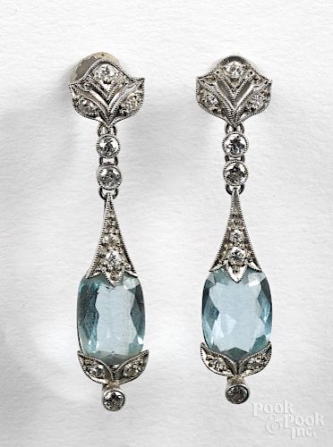Pair of 14K white gold diamond earrings