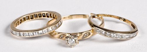 Three 14K yellow gold diamond rings