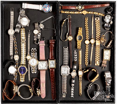 Group of men and women's wristwatches.