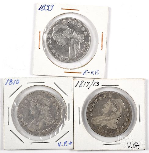 Three capped Liberty half dollar coins