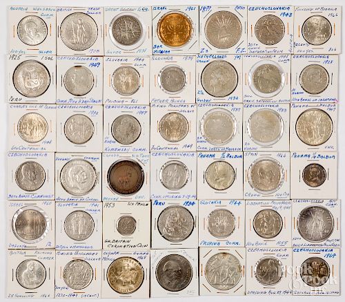 Group of mostly silver foreign coins.