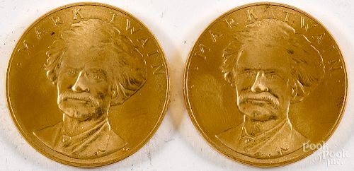 Two Mark Twain American Arts gold medallions.