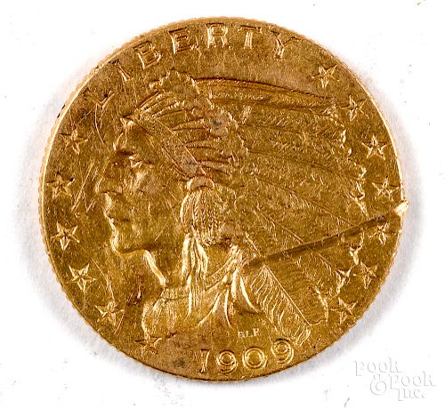 1909 Indian Head two and a half dollar gold coin.
