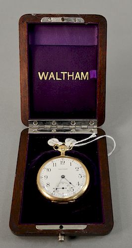 14 karat gold Waltham open face pocket watch in original Waltham wooden box. 49 mm