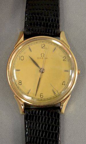 Omega 14 karat gold vintage men's wristwatch with black leather band (stem missing).