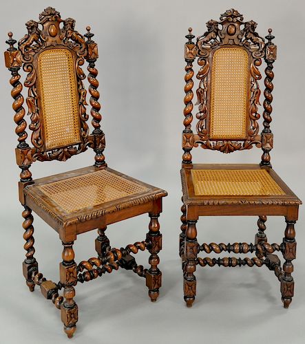 Set of fifteen plus one near matching caned walnut side chairs, each with dual carved lions and twist turned supports and legs (all ...