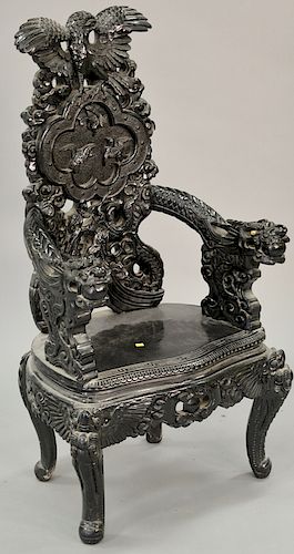 Carved Oriental armchair with dragon carved hand rests. ht. 50 in. Provenance: From an estate in Lloyd Harbor, Long Island, New York