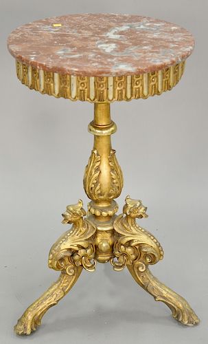 Carved gilt and round stand having marble top with bird's heads on tripod base. ht. 31 in., dia. 18 in.