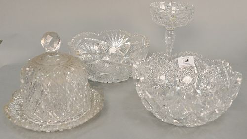 Four piece American Brilliant cut glass lot with covered butter dish, compote, and two bowls. Provenance: From an estate in Lloyd Ha...