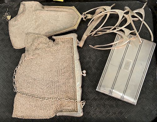 Ten piece silver lot to include two purses, one cigar case, and seven wishbone sugar tongs. 17.5 t oz.