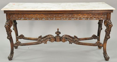 Carved hall table with faces and marble top. ht. 31 1/2 in., top: 21 1/2" x 61 1/2"