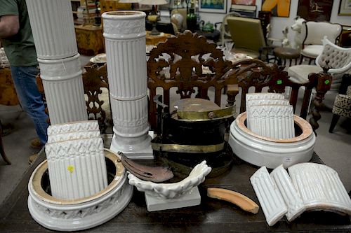 Two piece group including white glazed ceramic cylindrical stove with brass bands (apart) and a white glazed pedestal.