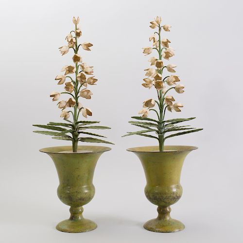 Pair of French Tôle Peinte Urns Containing Tôle Peinte Floral Plants, Fitted into Marble Urns