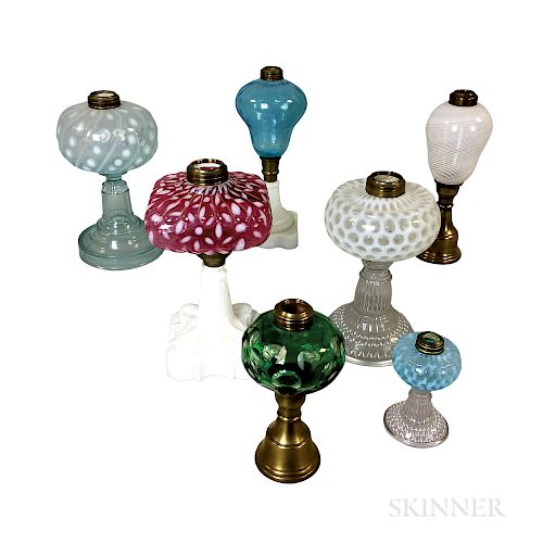 Seven Mostly Pressed Glass Fluid Lamps