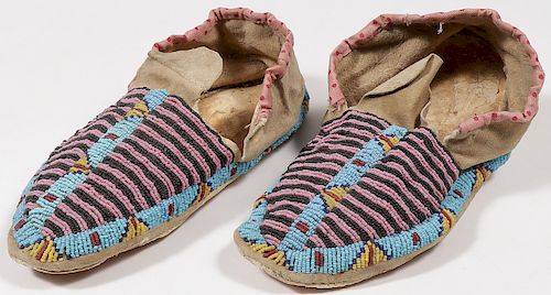A PAIR OF PLAINS BEADED MOCCASINS, CIRCA 1890