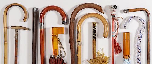 AN ASSORTMENT OF 12 CANES AND UMBRELLAS