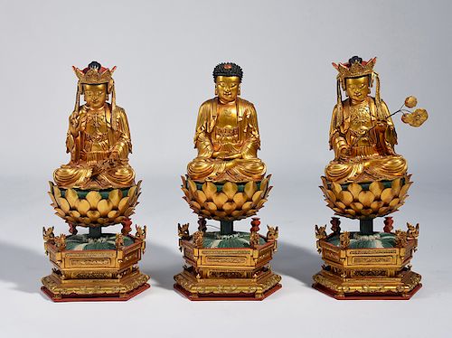 Three Chinese carved and gilt wood Buddhas