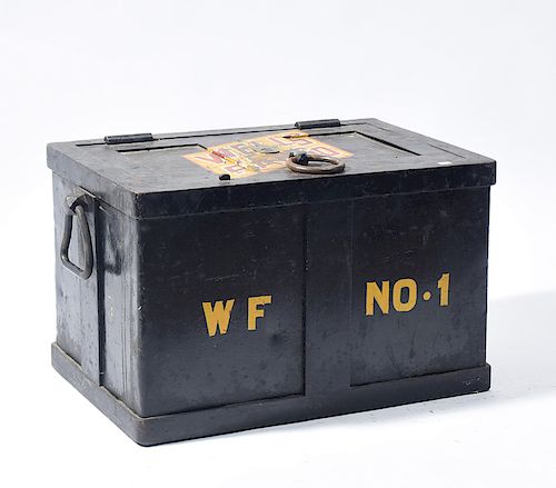 Antique iron strong box with Wells Fargo insignia on lid