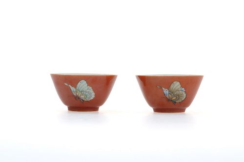 A PAIR OF CORAL RED GILDED BUTTERFLY CUPS