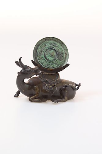 A CHINESE BRONZE 'QILIN' STAND AND HAN DYNASTY MIRROR 