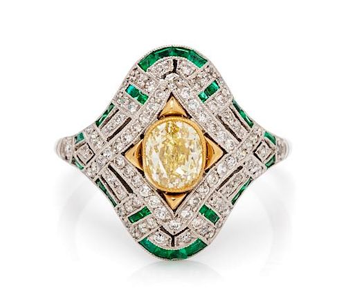 A Platinum, Yellow Gold, Fancy Yellow Diamond, Diamond and Emerald Ring, 4.00 dwts.