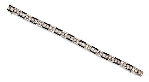 An Art Deco Platinum, Diamond and Onyx Bracelet, 12.23 dwts.