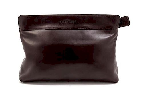 * A Chanel Brown Leather Large Clutch, 12 x 8 x 3 inches.