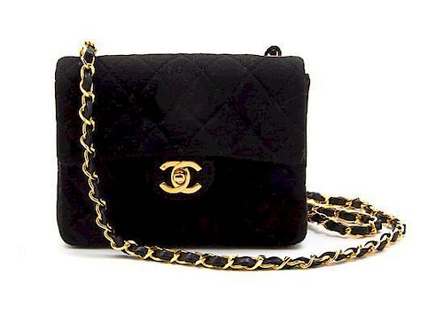 * A Chanel Black Quilted Wool Jersey Flap Bag, 7 x 5 1/2 x 2 1/2 inches.