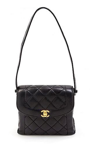 A Chanel Black Quilted Leather Bag. 8 x 7 1/2 x 3 inches.