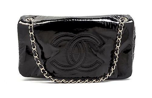 * A Chanel Black Patent Vinyl Bag, 11 x 6 1/2 x 3 inches.