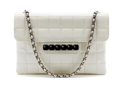 * A Chanel Ivory Patent Leather Digital Flap Bag, 8 x 5 1/2 x 1 inches.