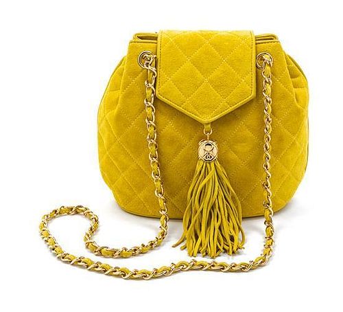 * A Chanel Yellow Quilted Suede Bag, 8 1/2 x 7 x 3 inches.