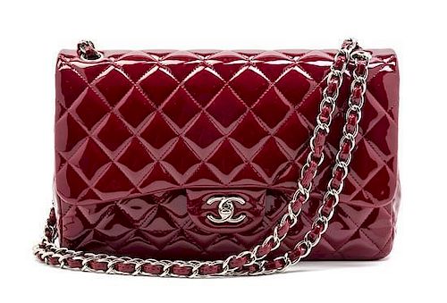 A Chanel Red Patent Leather Jumbo Double Flap Bag, 12 x 8 x 3 1/2 inches.