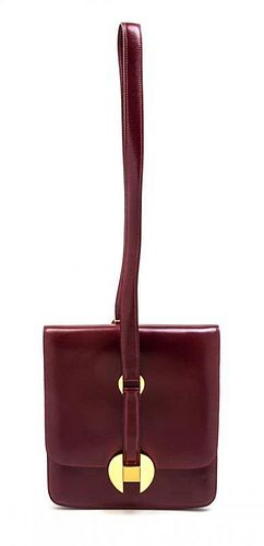 * An Hermes Rouge Leather Shoulder Bag, 9 x 8 x 1 inches.