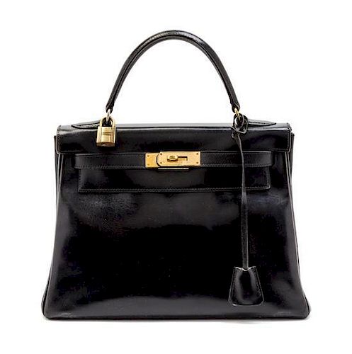 An Hermes 28cm Black Calf Leather Kelly Bag, 11 x 8 x 4 1/2 inches.