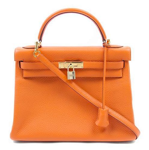* An Hermes 32cm Orange Leather Kelly Bag,