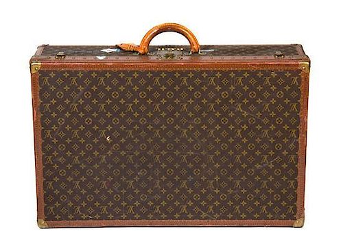 * A Louis Vuitton Monogram Canvas Hard-sided Suitcase, 30 1/2 x 20 x 8 inches.