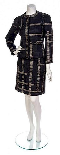 * A Chanel Black and Gold Cotton Tweed Skirt Suit,
