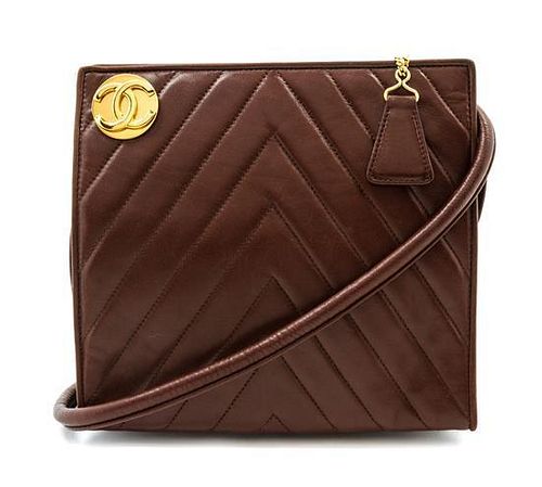 * A Chanel Brown Chevron Quilted Leather Bag, 7 1/2 x 7 x 1 1/2 inches.