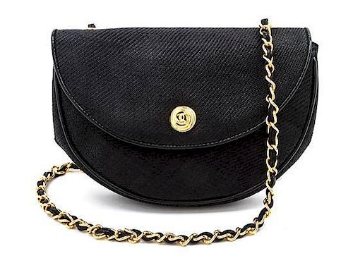 * A Chanel Black Woven Straw Flap Bag, 8 x 6 x 2 inches.