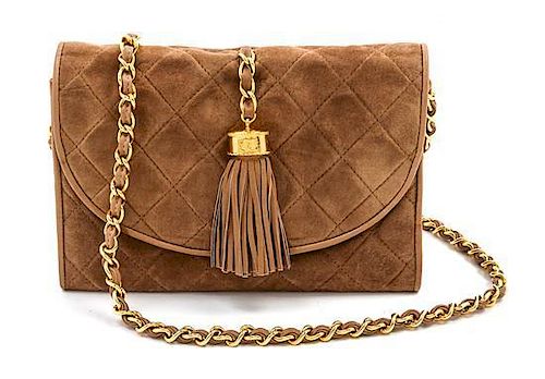 * A Chanel Tan Suede Quilted Flap Bag, 8 x 5 1/2 x 1 1/2 inches.