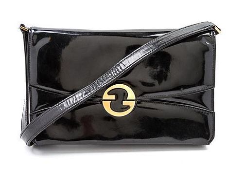 * A Gucci Black Vinyl Convertible Bag, 11 1/2 x 10 1/2 x 5 inches.