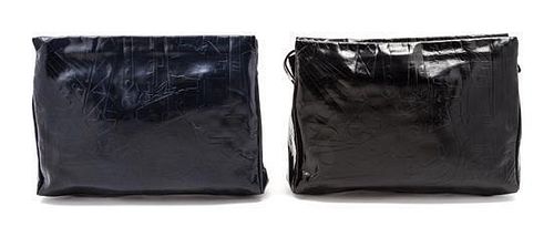 * Two Prada Embossed Leather Oversized Clutches, 15 x 10 x 2 inches.