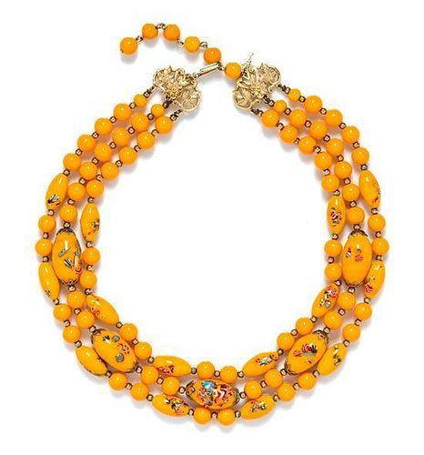 * A Trifari Hand Painted Triple Strand Orange Necklace.