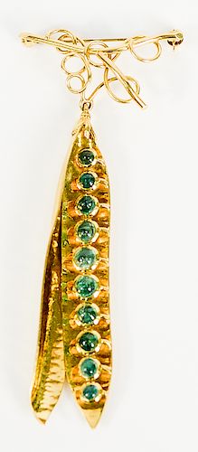18 karat gold pea pod brooch with ten emeralds marked FWE.  18.7 grams.