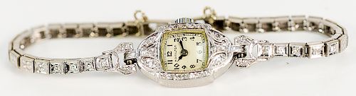 Hamilton platinum ladies wristwatch with 14 karat and diamond band.  18.68 grams total weight